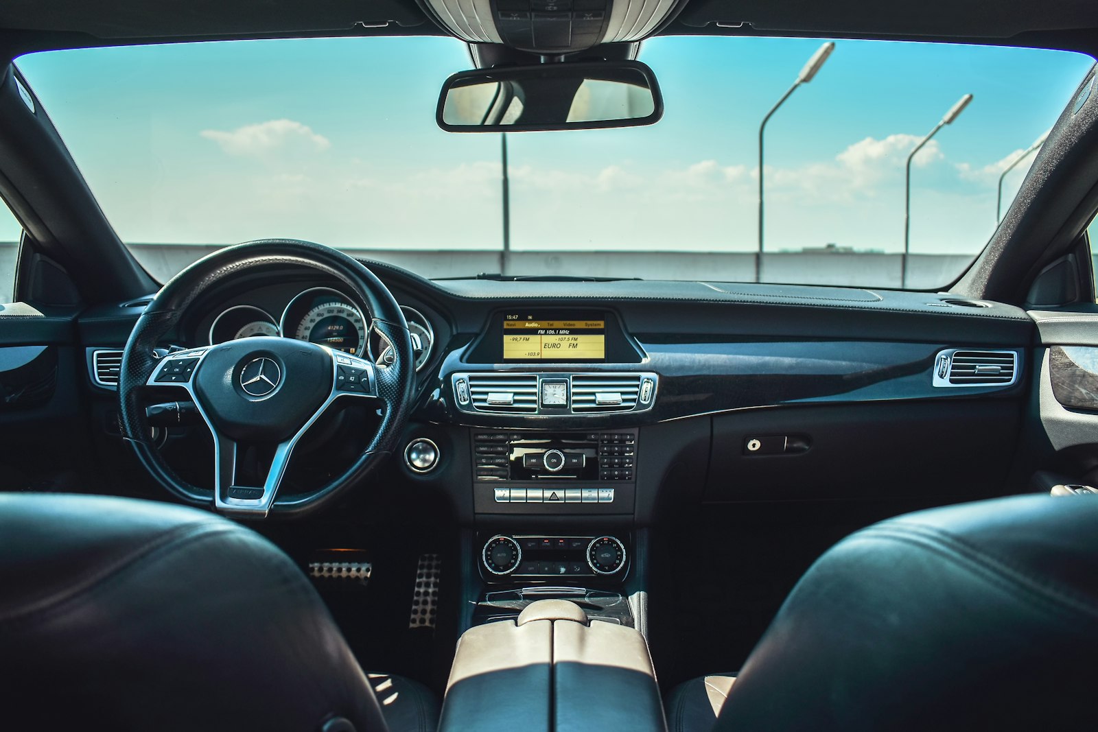 Black Mercedes-Benz vehicle steering wheel